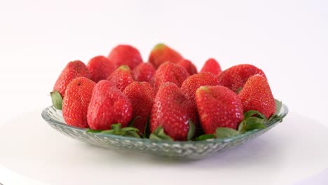 A plate of fresh strawberries