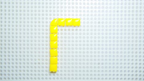 stop-motion-of-the-letter-A-creating-one-pixel-at-the-time,-made-with-children-toys