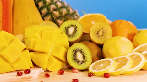 vibrant fruits arranged against a blue background