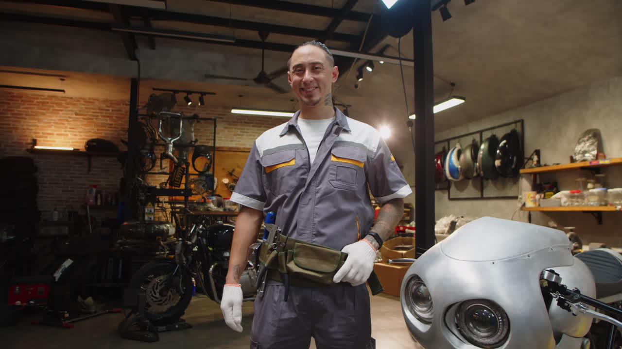 Portrait of Multicultural Mechanic in Motorbike Workshop