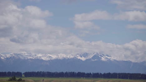 timelapse of snow mountain and forest and cloud in wanaka