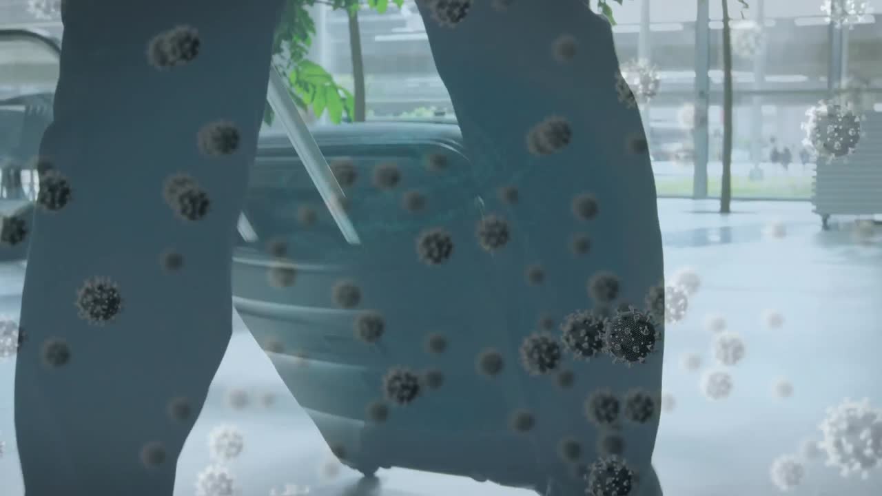 animación de células virales sobre las piernas de un hombre de negocios caminando con una maleta