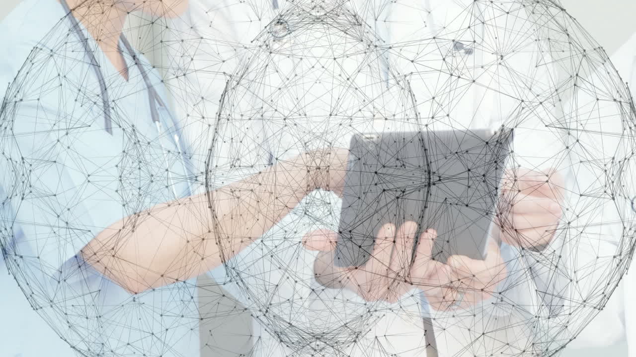 Using tablet with network animation overlay, healthcare professionals collaborating