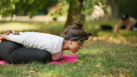 woman practicing yoga outdoors