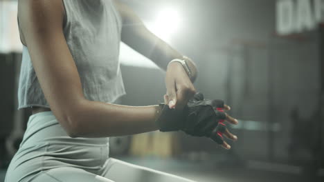 a woman preparing for a workout at the gym