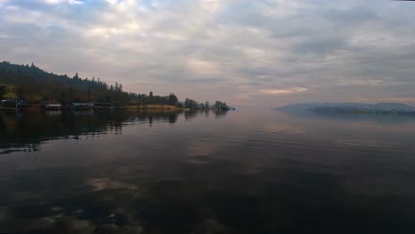 misty scene over lake windermere in the english lake district national park