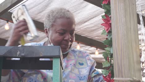 woman decorating for christmas holiday