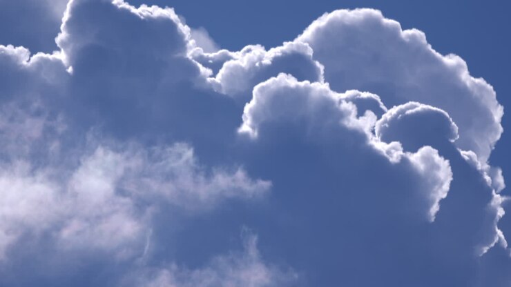Cumulus Clouds Covering Up The Blue Sky
