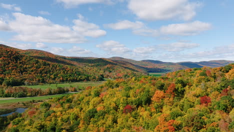 aerial drone shot of beautiful vermont mountains during peak fall foliage