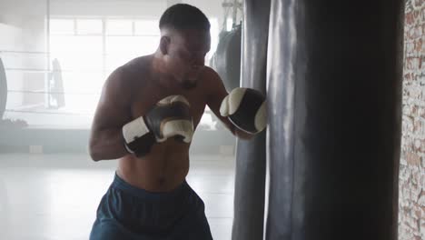 video of fit african american man boxing at gym