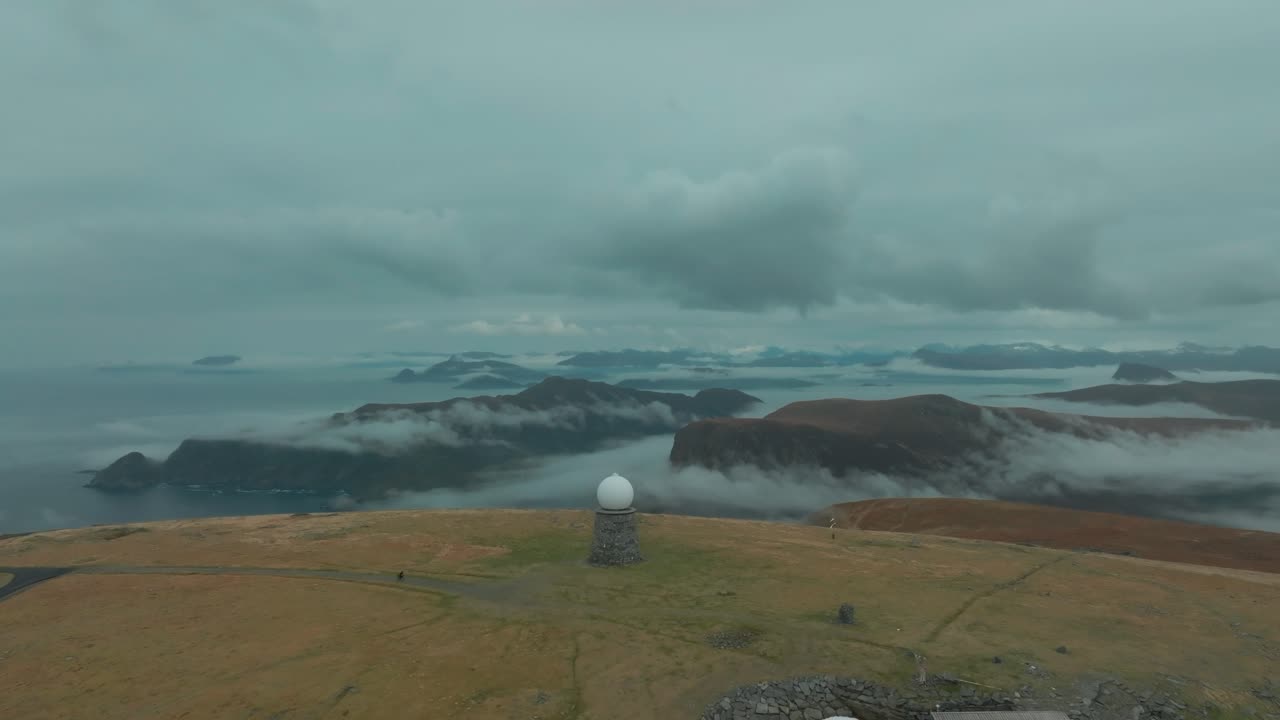 cycling tourist at Vestkapp viewpoint in Norway