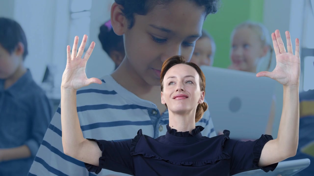 On cue presenter lifting and opening palms, tilting head, smiling engaging students on laptops