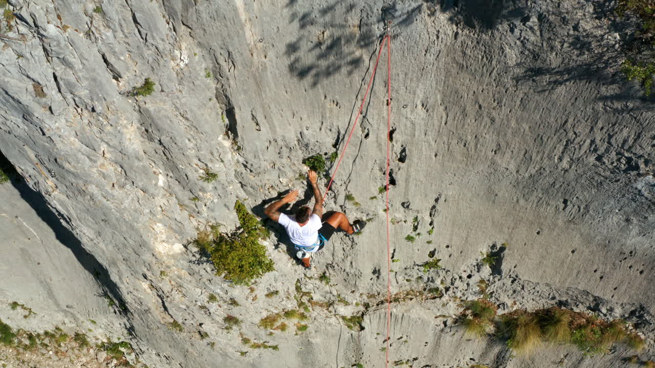 Athletic Man On Harness Climbing On Limestone Canyon Of Vela Draga At Summer In Vranja, Croatia