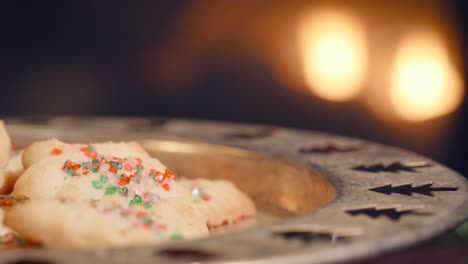 plate of christmas cookies left out for santa claus by a fireplace in 4k