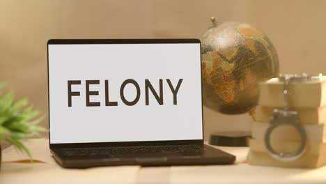 felony displayed in legal laptop screen