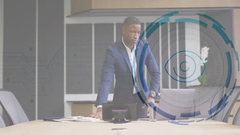 businessman leaning on conference table presenting corporate data with floating ui graphics overlay