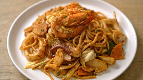 stir fried tom yum seafood dried spaghetti - fusion food style