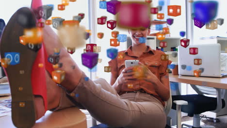 digital icons floating against woman using smartphone at office