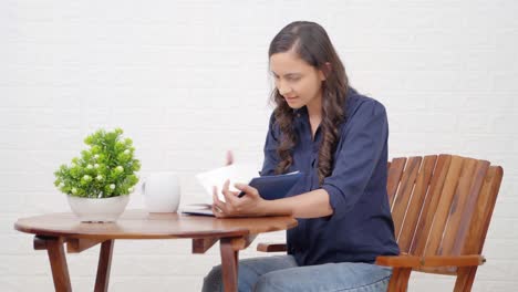 indian girl searching something in book