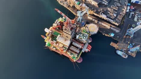 birdseye aerial view of hercules offshore drilling rig at westcon shipyard, olensvag, norway. high angle reveals structure, maintenance, and offshore energy industry