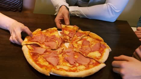 group of friends having a pizza