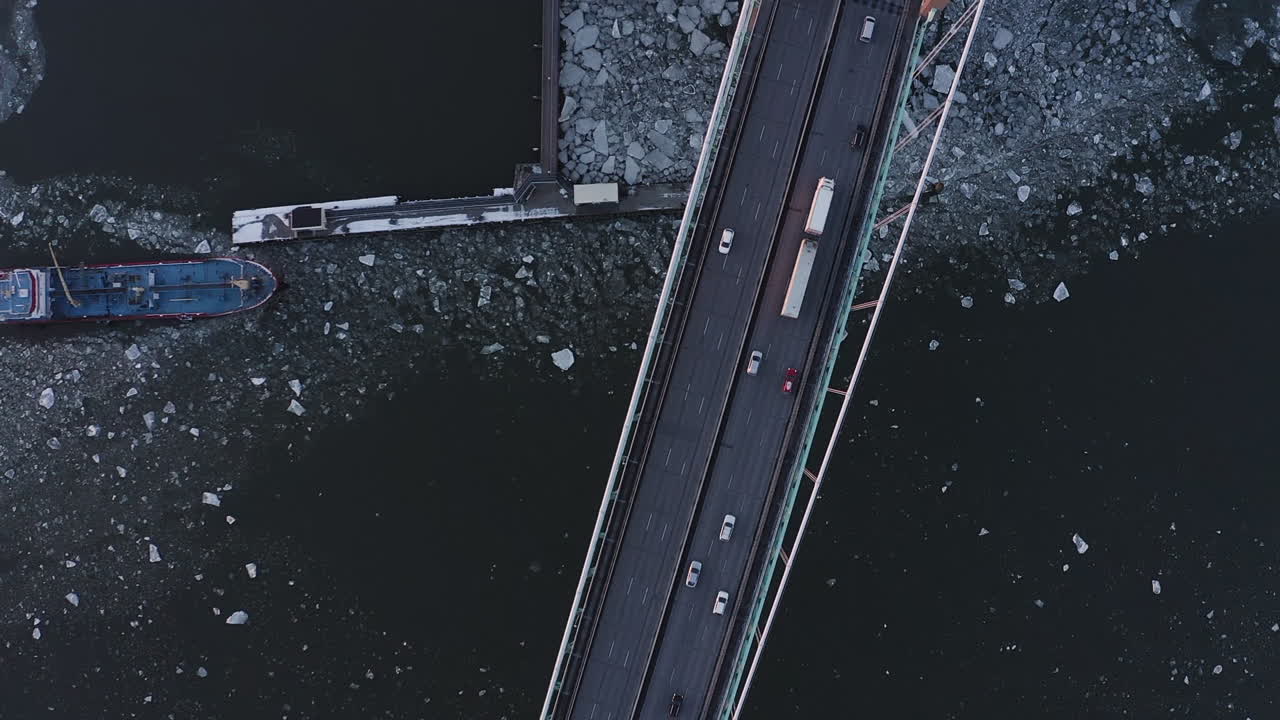 Static drone top view shot of a large bridge in Gothenburg, Sweden.