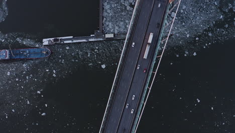 static drone top view shot of a large bridge in gothenburg, sweden.