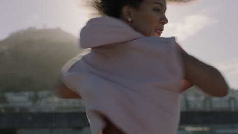 dancing-woman-young-beautiful-street-dancer-with-afro-performing-contemporary-moves-enjoying-urban-freestyle-dance-in-city-close-up