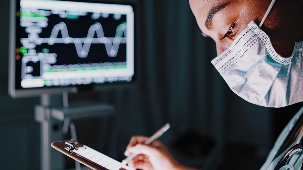 Close-up video shot of a healthcare worker in a mask, highlighting their focused eyes