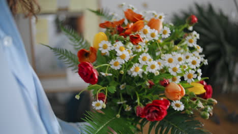 closeup beautiful flowers decoration. florist hands pick spring fresh bouquet.