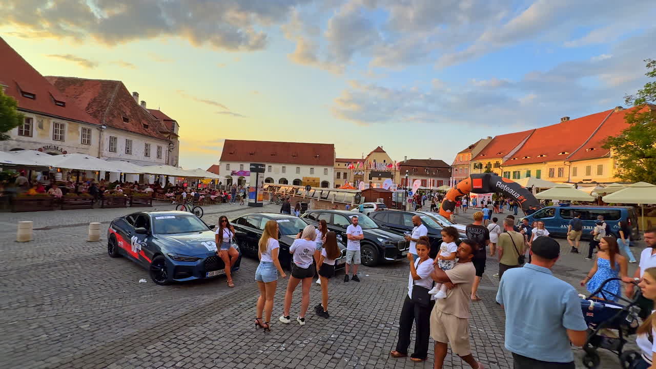 Sibiu, Romania, 17 July 2025: Evening crowd at Sibiu city square. People gather at the main square in Sibiu, Romania during sunset