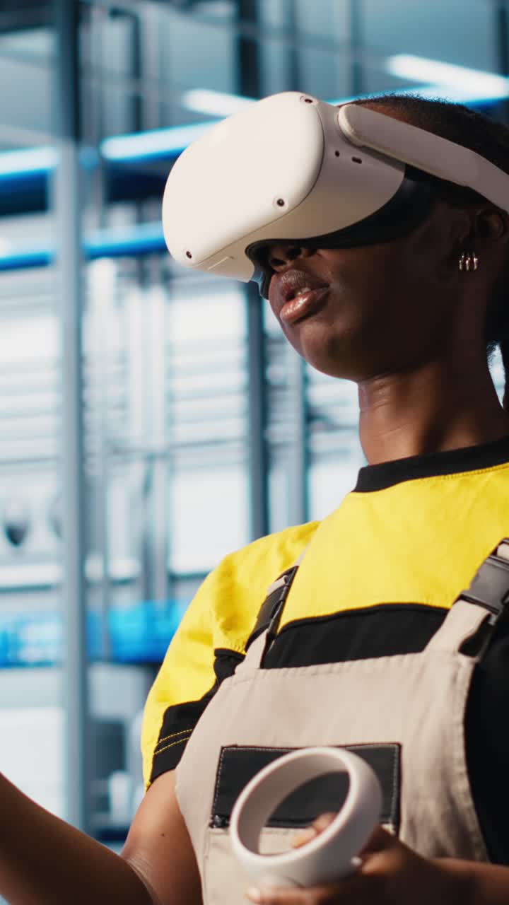 Vertical video Engineer wearing VR headset in smart factory looking at data to do optimizations