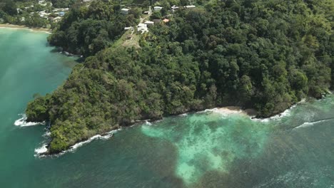 Descending-aerial-view-of-Lovers-Bay-cove-snorkelling-spot-only-accessible-by-boat-on-the-island-of-Tobago