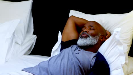 senior man sleeping in bedroom 4k