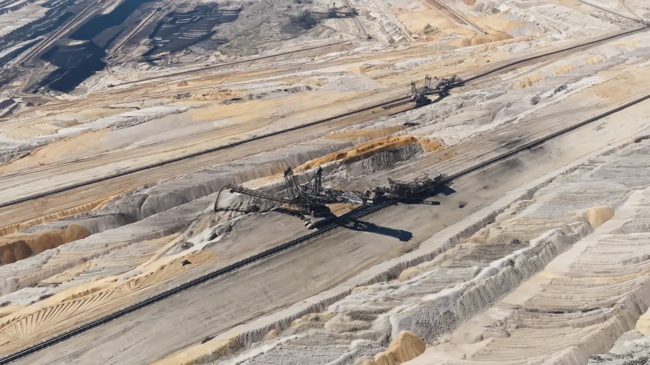 Ascending aerial of excavating machine on lignite coal mine in Germany