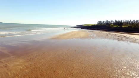 woman horse riding on seashore