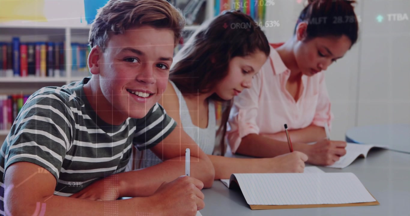 Students studying at library table, generating data overlays as boy pauses, glancing and smiling