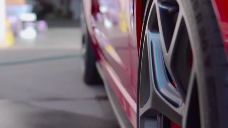 low reveal shot of sports car alloy wheels