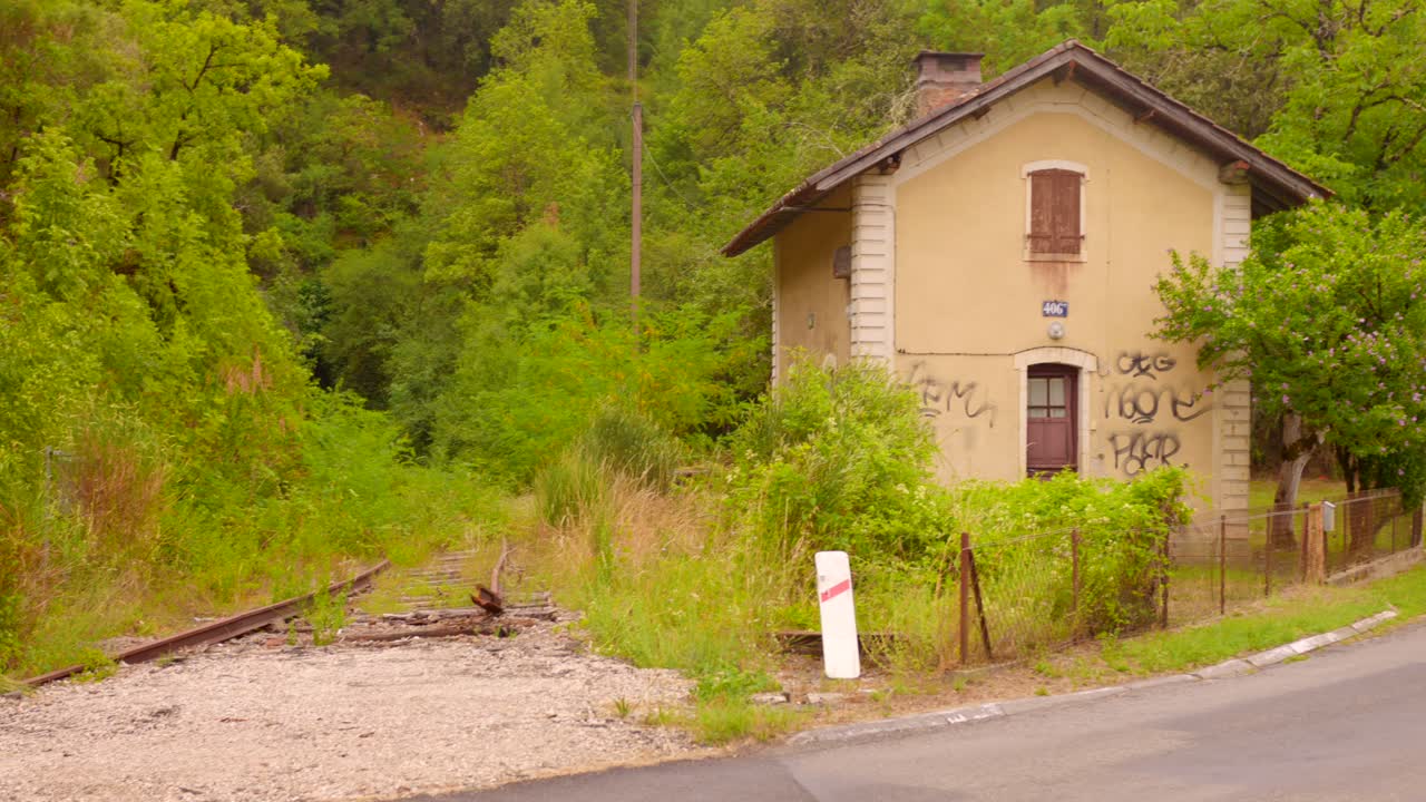 Abandoned Railway Station Surrounded by Nature