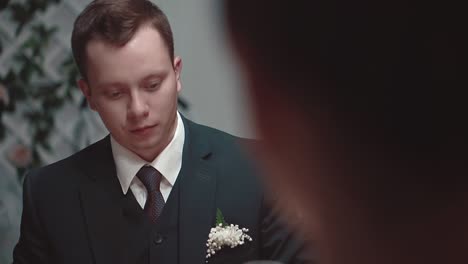 young man talking while sitting at a table in a restaurant close-up