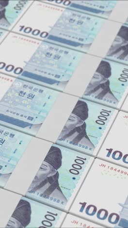 video vertical de billetes de 1.000 won surcoreanos impresos por una imprenta de dinero