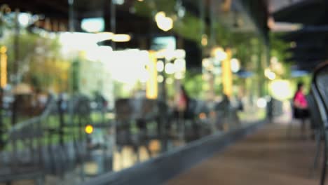 blurred motion of people in restaurant blur background