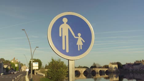 White-circle-with-blue-background-signage