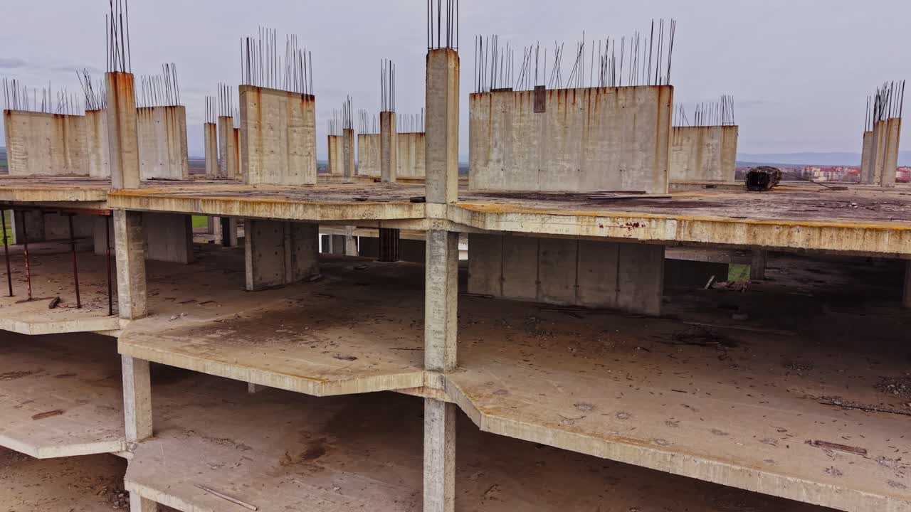 Aerial view of abandoned building revealing concrete structure and decay