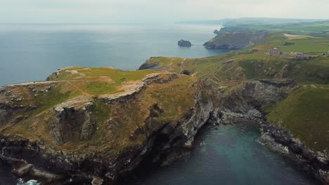 cornwall's tintagel castle ruins on atlantic coast, aerial view