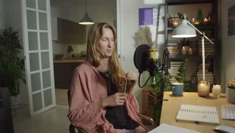 girl recording podcast at home
