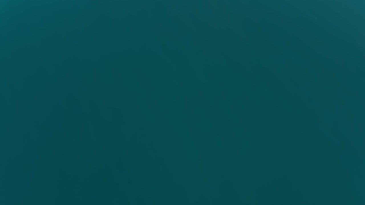 Aerial shot of beach from high angle to horizon level