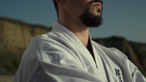 judo fighter warming up hands training outdoor close up. man practicing karate.