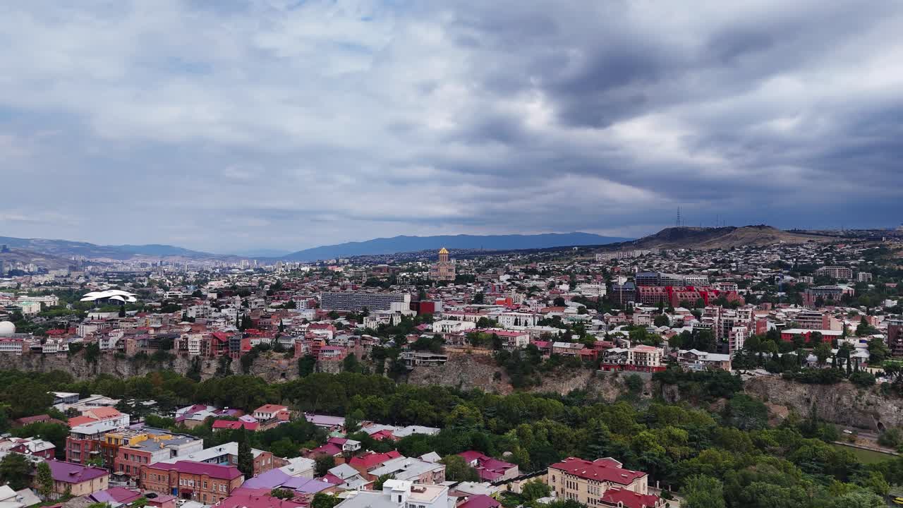 Aerial cityscape with holy trinity cathedral and stormy skyline