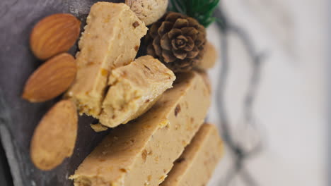 vertical shot of typical spanish nougat turrones de jijona in rotating plate setup